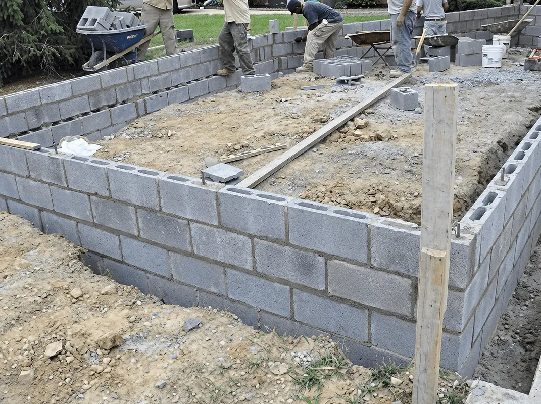 Professionals building a foundation with blocks in Grand Rapids, MI