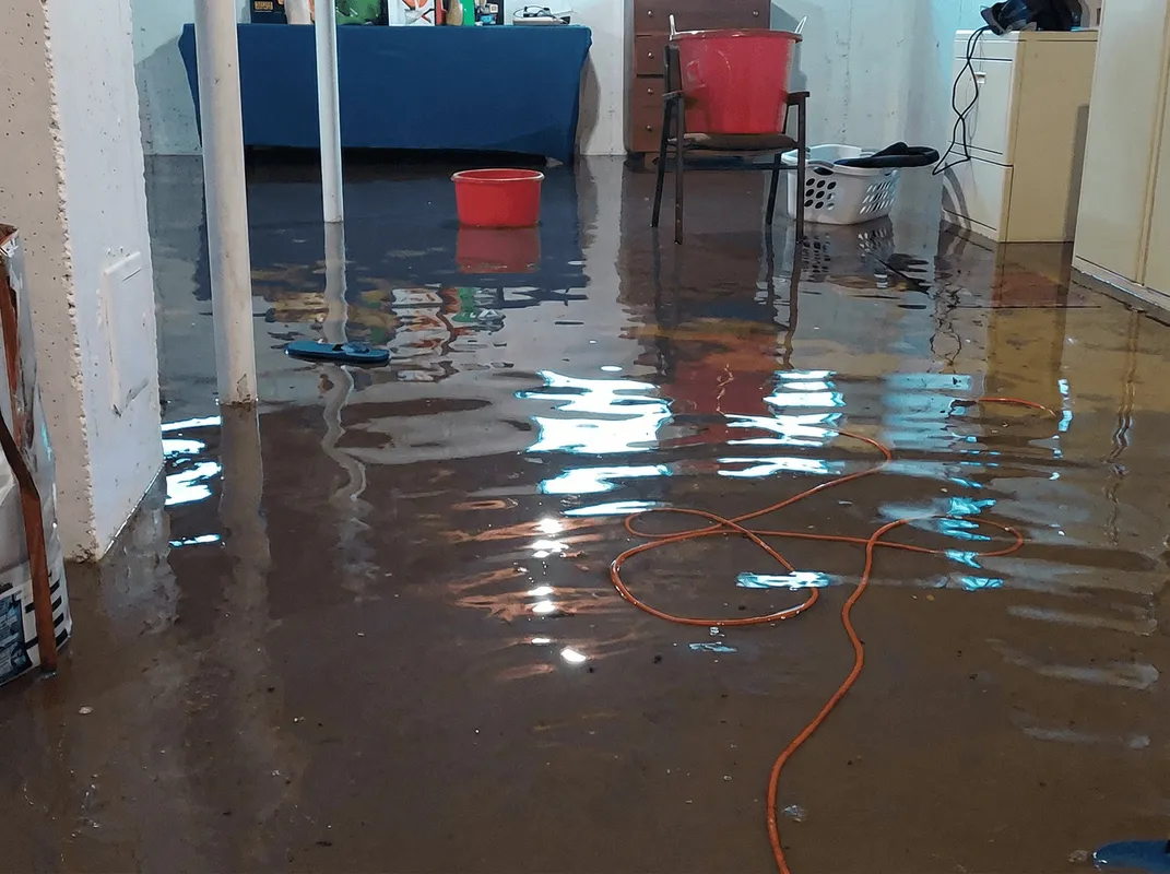 Basement with boiler, cabinets and washing machine completely flooded in Grand Rapids, MI